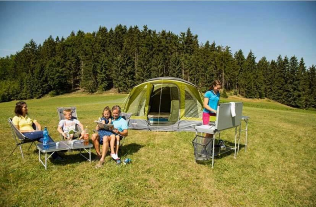 Family camping holiday . Family tent with camping essentials for a staycation holiday.